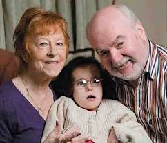 As a baby born with Edwards&#39; syndrome (Trisomy 18), Elaine Fagan was. Elaine with her parents, Kay and Michael. The congregation held their breath as ... - elaine-with-her-parents