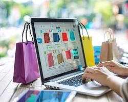 person browsing an online store on their laptop resmi