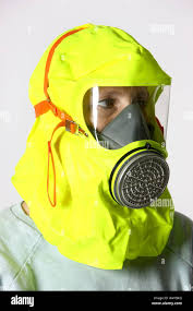 Person wearing an emergency smoke hood that is used to ...