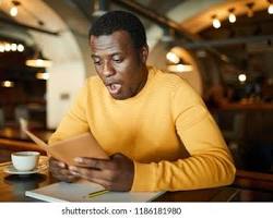 Image of someone looking shocked at a restaurant bill