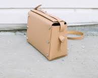 Image of minimalist micro tote crafted from beige leather