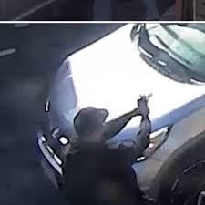 Federal agents near a man detained after a reported ICE shooting in New York City