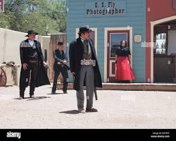 Image of modernday reenactment of the Gunfight at the O.K. Corral, with actors portraying the historical figures