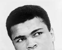 Image of Muhammad Ali five incredible career moments boxing highlights 1960 Olympic gold Sonny Liston 1964 Rumble in the Jungle 1974 Thrilla in Manila 1975 1996 Olympic cauldron lighting