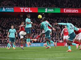 Arsenal edge past Wolves thanks to late own goal