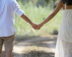 Image of couple holding hands, love story