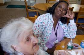 Eloise Knight, CNA, talks to patient Gertrude Passiotti at the Richard L. Rosenthal Hospice Residence in Stamford, Conn. on Friday June 4, 2010. - 628x471