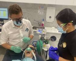 Image of patient smiling after a successful dental procedure with nitrous oxide sedation