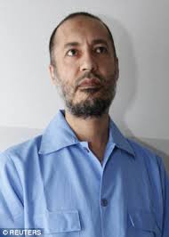 Image result for hillary clinton with gaddafi son