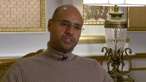 Image result for hillary clinton with gaddafi son