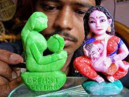 The Hindu Artist Satya Maharana displays models carved from cakes of soap to raise awareness during the Breastfeeding Week. Photo: Lingaraj Panda - 08DMC_1544030f