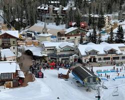 Image of Taos Ski Valley, New Mexico with adobestyle buildings and snowcovered mountains