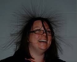 Melanie Snow takes on the challenge of putting her hand on the van de Graaf generator at maybe 100,000 volts. - 87melvdgs