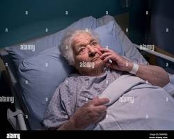Image of confused looking person in a hospital gown