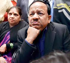 The real work starts now: Delhi BJP CM candidate Harsh Vardhan pictured with his wife at his residence at Krishna Nagar in east Delhi - article-2520369-19F6E85900000578-831_472x423