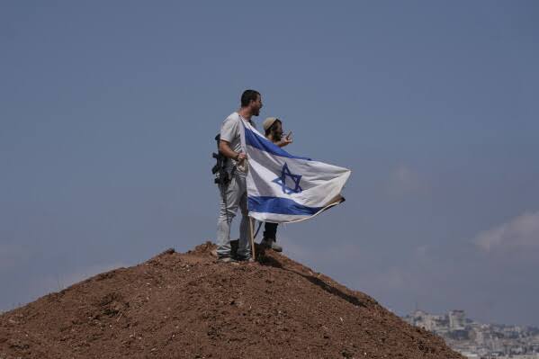 Palestinians in Qusra remain trapped in homes as Israeli military fails to remove settlers; defense minister plans to shift law enforcement to police