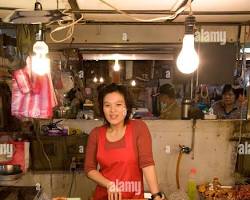 various food items available at a market stallの画像