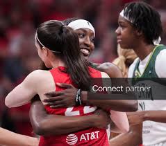 Licensable picture: Indiana Fever guard Caitlin Clark (22) and Seattle Storm guard Flau'jae Johnson (4) hug Friday, July 17, 2026, before the first
