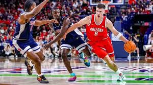 Arizona basketball players warming up at McKale Center before the 2026 exhibition against San Francisco