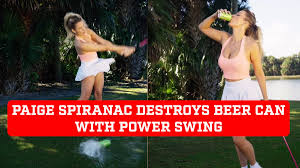 Paige Spiranac destroys beer can with power swing and shows a little more than expected.