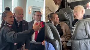 Joe Biden takes selfies with passengers as he takes commercial flight