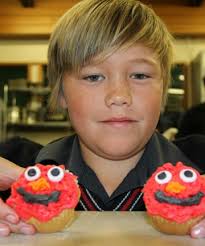 LOUISE BERWICK/Fairfax NZ. Southland Boys&#39; High School pupil Josh Chirnside, 12, with his Elmo-themed cupcakes, which gained him a second place in teh ... - 8592843