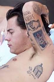 harry-styles-silver-spoon-tattoos Okay, so Harry Styles isn&#39;t completely done with written word tattoos. At about the same time that he debuted his Bible ... - harry-styles-silver-spoon-tattoos