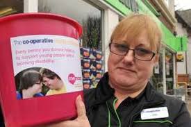 Assistant manager Julie Russ with one of the Co-op&#39;s charity boxes. A 24-YEAR-OLD woman who stole a charity box to buy drugs has been jailed for 20 weeks. - C_67_article_2092651_body_articleblock_0_bodyimage