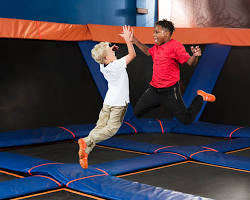 Image of people jumping on trampolines at Sky Zone