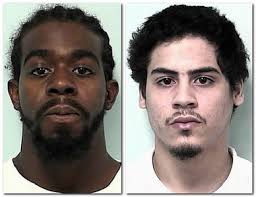 Lesie Evans, left, and Manuel Lora are two of three men accused of illegal gun possession in Springfield. SPRINGFIELD - Two men were sentenced to federal ... - 11631625-large