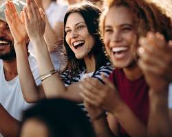 person cheering with a group of friendsの画像