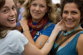 Get inked: From left, Somerville residents Liz Olsen, Melissa Zgola, and Sara Decotis showed off their Fluff Boy tattoos. In honor of the festival, ... - 499w