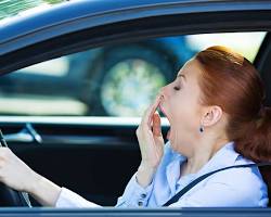Image of person yawning while driving