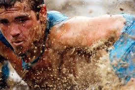 ... nine mile endurance event which runs competitors through a military style obstacle course complete with mud, water and fire. (Reuters/Jessica Rinaldi) # - m16_RTR34YXE