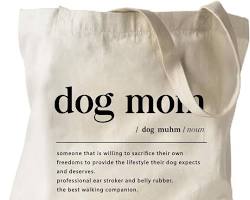 person walking their dog with a tote bagの画像