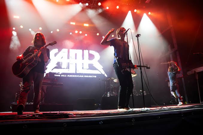 All-American Rejects' State Fair show began with broken mic, dissolved into cheese curd ode and cream puff baptism; Ritter declared 'I am forever baptized in your cream puffness'