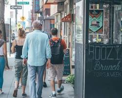 Image of tourist walking down a side street in New York City.