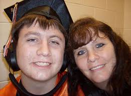 Fight for justice: Bobby&#39;s mother, Julie Clark, right, and his father, Robert Clark II are suing the school district and the helmet manufacturer after their ... - article-2447511-18918F5D00000578-705_634x469