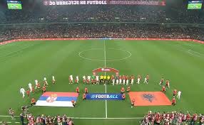 The teams take to the field, the Serbian anthem is greeted with whistles