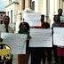 Protest to reinstate ex-Jersey CityRec Director Ryan Strother barely...