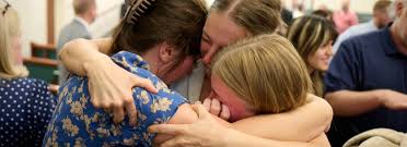 Elder David Bednar provides support to Grand Blanc shooting survivors