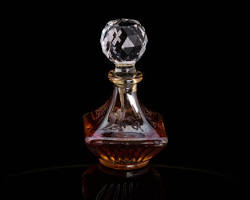 luxury traditional glass attar perfume oil bottle crystal bottle dark background, AI generated
