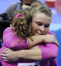 Gold medallist US gymnast <b>Bridget Sloan</b> hugs silver medallist US. - 91955132-gold-medallist-us-gymnast-bridget-sloan-hugs-gettyimages