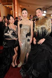 EJAE, Rei Ami, and Audrey Nuna from Kpop Demon Hunters Coordianted in Gold at the 2026 Oscars