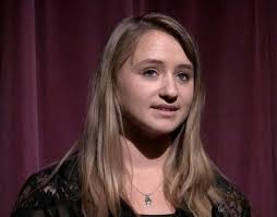 Anna Baum recites her poem at Boothbay Region High School&#39;s Poetry Out Loud contest. Courtesy of Jonne Trees. Anna Baumm sat in a dimly lit auditorium ... - E-Baumm-article-2%2520col