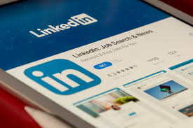 LinkedIn adds feature allowing users to report posts as 'AI slop'; Chief Product Officer Hari Srinivasan calls it a top priority.