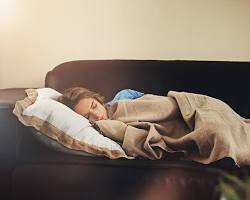Image of person surfing on a couch