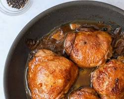 Chicken Adobo simmering in a skillet