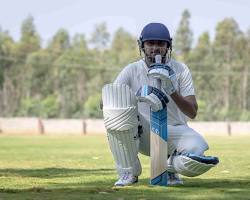 Image of cricketer with cricket gear