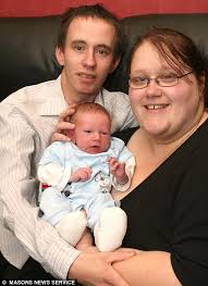 Proud parents: Sarah Wilkinson and Martin Jones at home with baby Jack. Miss Wilkinson had no idea she was pregnant. Recovering with her new baby, Jack, ... - article-1230886-075BDF35000005DC-540_468x644